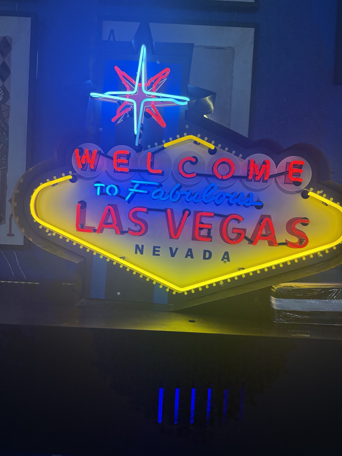 Colorful illuminated Welcome to Fabulous Las Vegas Nevada decorative sign inside HolySheets Galleria